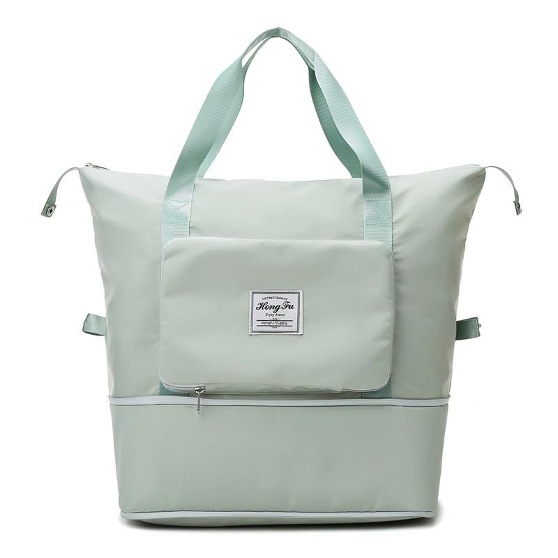 Sac à langer vert menthe avec poches multiples, design moderne et spacieux, idéal pour les parents. Accessoire pratique pour bébé.
