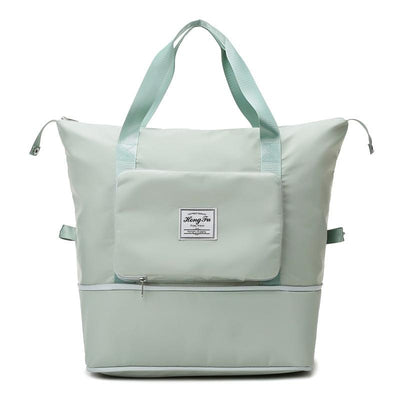 Sac à langer vert menthe avec poches multiples, design moderne et spacieux, idéal pour les parents. Accessoire pratique pour bébé.