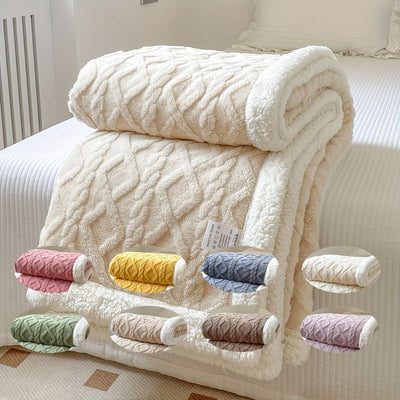 Couverture en laine beige sur un lit, avec motifs géométriques. Options de couleurs variées en bas: rose, jaune, bleu, vert, marron, violet.