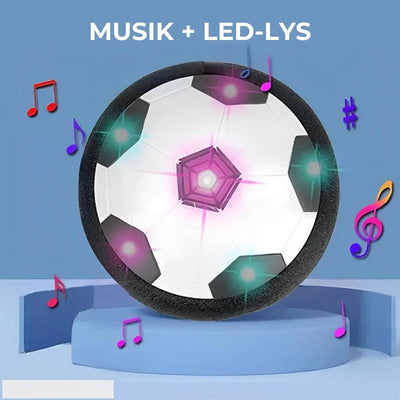 Ballon de football flottant avec lumières LED colorées et notes de musique, sur fond bleu. Jouet interactif pour enfants, idéal pour intérieur.