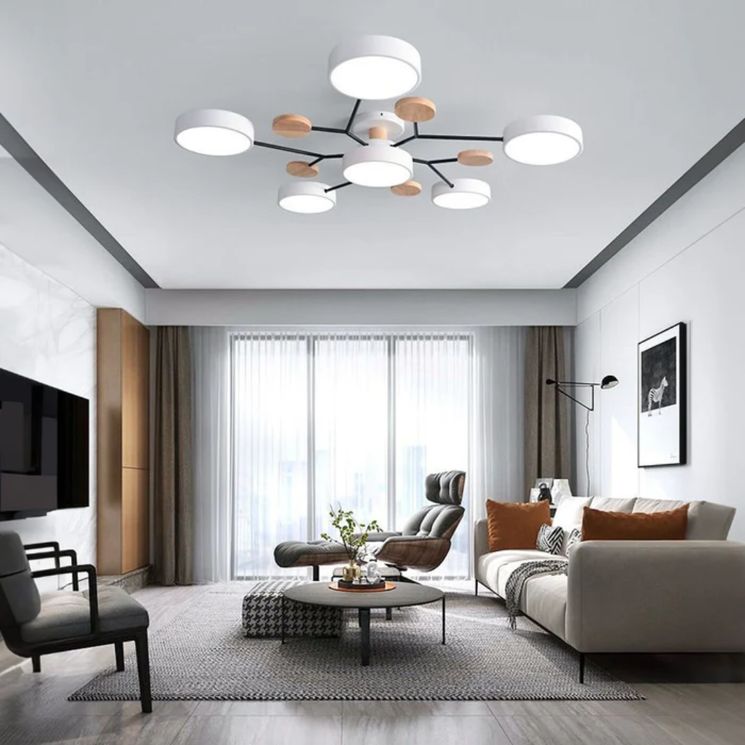 Salon moderne avec canapé beige, table basse ronde, et plafonnier design noir et bois. Décor élégant, lumière naturelle, ambiance contemporaine.