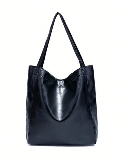Sac à main en cuir noir élégant avec anses longues, design minimaliste. Accessoire mode femme, tendance et pratique pour usage quotidien.