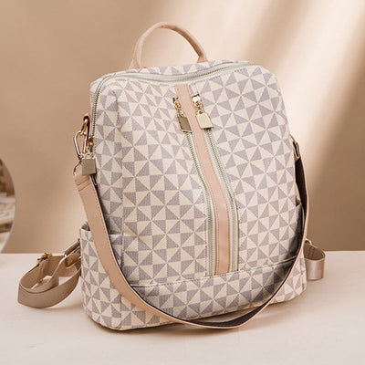 Sac à dos élégant en toile beige avec motifs géométriques, fermeture éclair dorée, bretelles ajustables. Accessoire mode tendance pour femmes.