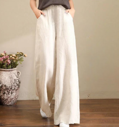 Pantalon large en lin beige pour femme, style décontracté, avec taille élastique. Parfait pour un look estival chic et confortable.