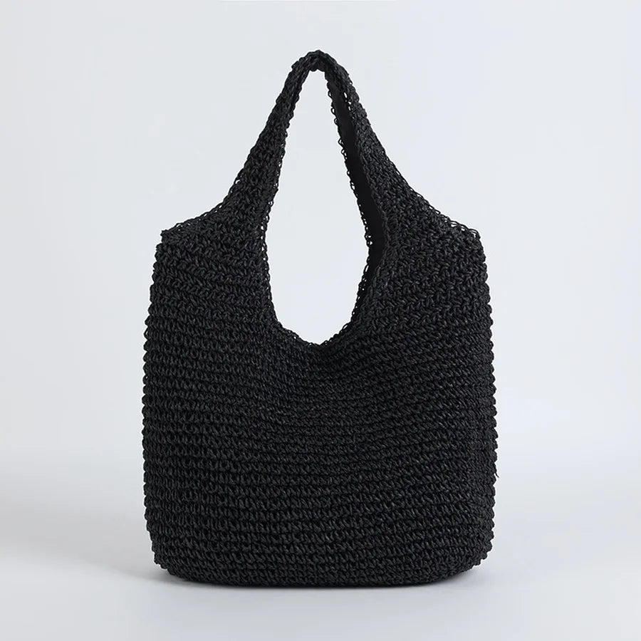 Sac cabas noir en crochet, design élégant et moderne, idéal pour le shopping ou la plage. Accessoire tendance, mode durable et pratique.