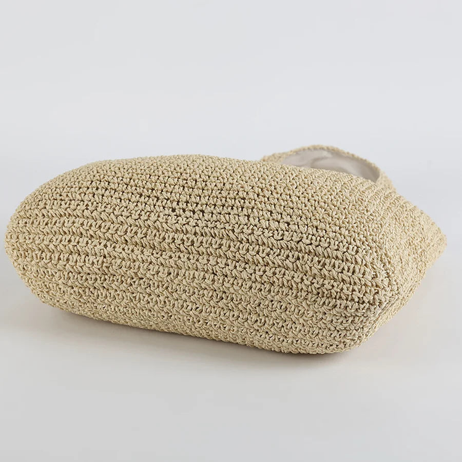 Sac en paille tressée beige, design élégant et naturel, idéal pour l'été. Accessoire mode tendance, parfait pour la plage ou les sorties décontractées.