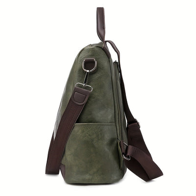 Sac à dos en cuir vert olive avec bretelles marron, vue latérale. Design élégant et moderne, idéal pour le voyage ou le quotidien.