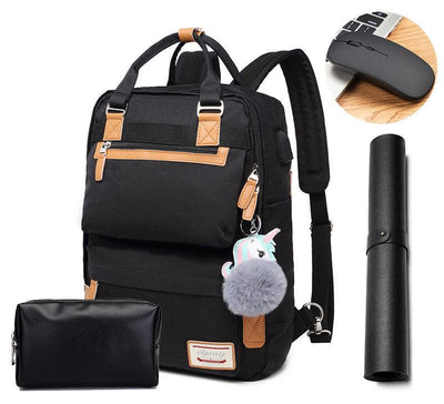 Sac à dos noir avec porte-clés licorne, pochette assortie, tapis de souris et souris sans fil. Accessoires de bureau modernes et pratiques.