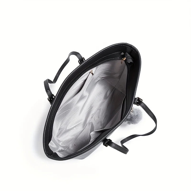 Sac à main noir ouvert avec intérieur gris, poignées élégantes, idéal pour femme moderne. Accessoire mode, tendance, pratique et spacieux.