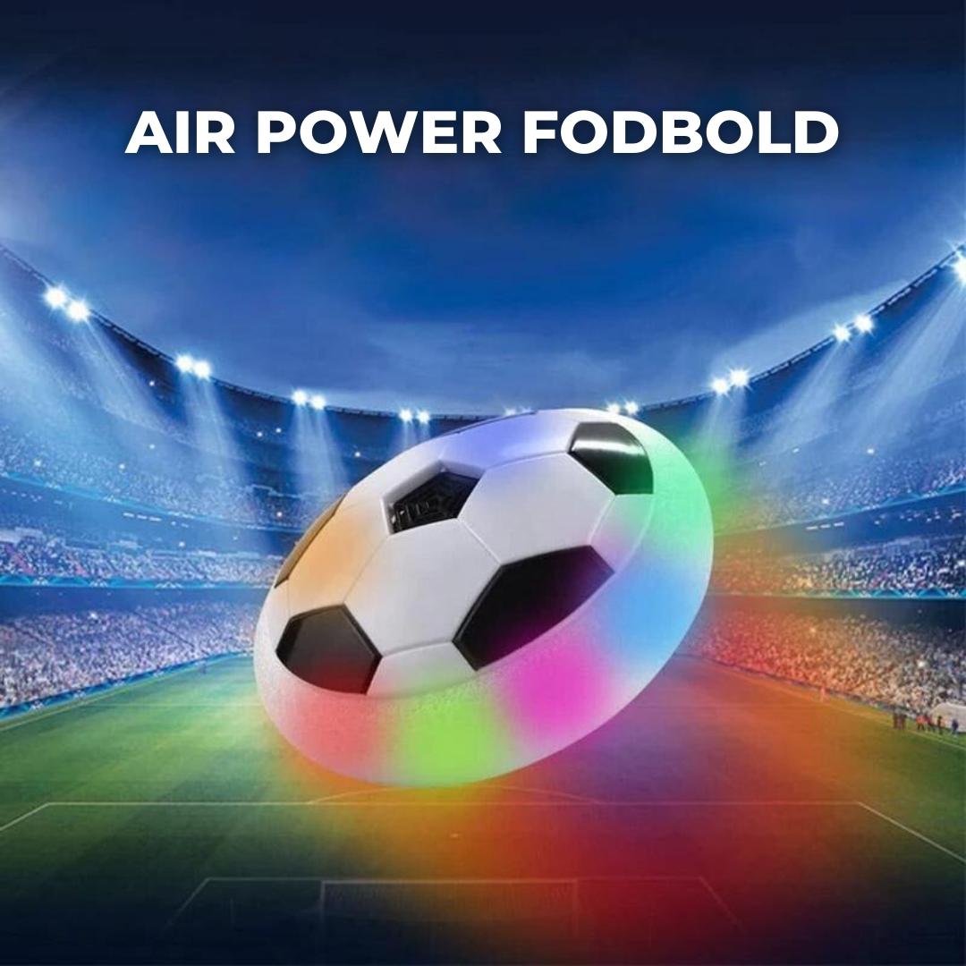 Ballon de football flottant lumineux dans un stade, éclairé par des lumières LED colorées, sur fond de ciel nocturne. Jouet interactif pour enfants.