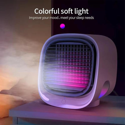 Mini climatiseur portable avec lumière LED colorée, posé sur une table. Idéal pour rafraîchir et éclairer l'espace, améliore l'humeur et le sommeil.