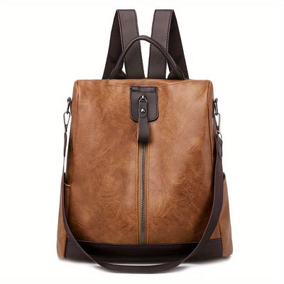 Sac à dos en cuir marron avec bretelles ajustables, fermeture éclair centrale et poche avant. Élégant et pratique pour le quotidien.
