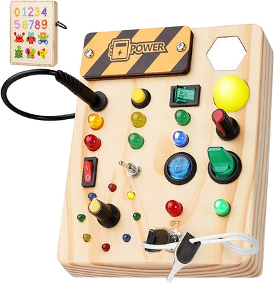 Jouet éducatif en bois avec boutons colorés, interrupteurs et lumières pour enfants. Stimule la motricité et l'apprentissage sensoriel.