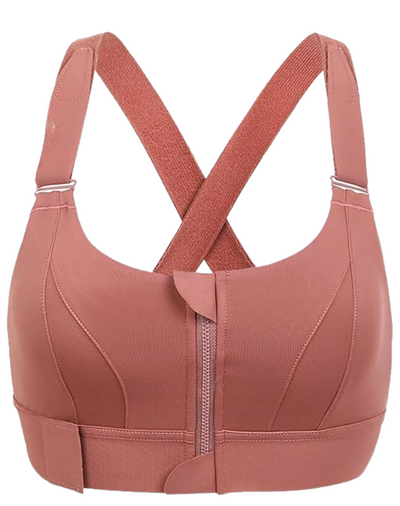 Soutien-gorge de sport rose avec fermeture éclair frontale, bretelles croisées, tissu respirant. Lingerie fitness femme, maintien optimal.