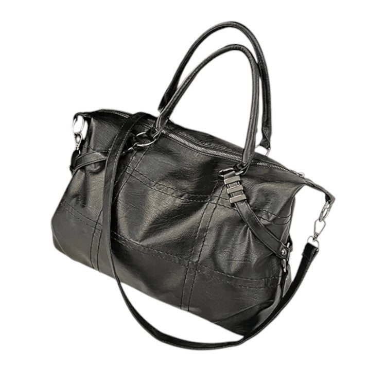 Sac à main en cuir noir élégant avec bandoulière amovible, poignées doubles, design moderne. Accessoire mode femme, tendance et pratique.