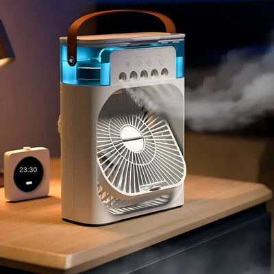 Ventilateur portable moderne avec éclairage LED bleu, poignée en cuir, posé sur une table de nuit, horloge numérique affichant 23:30 à côté.
