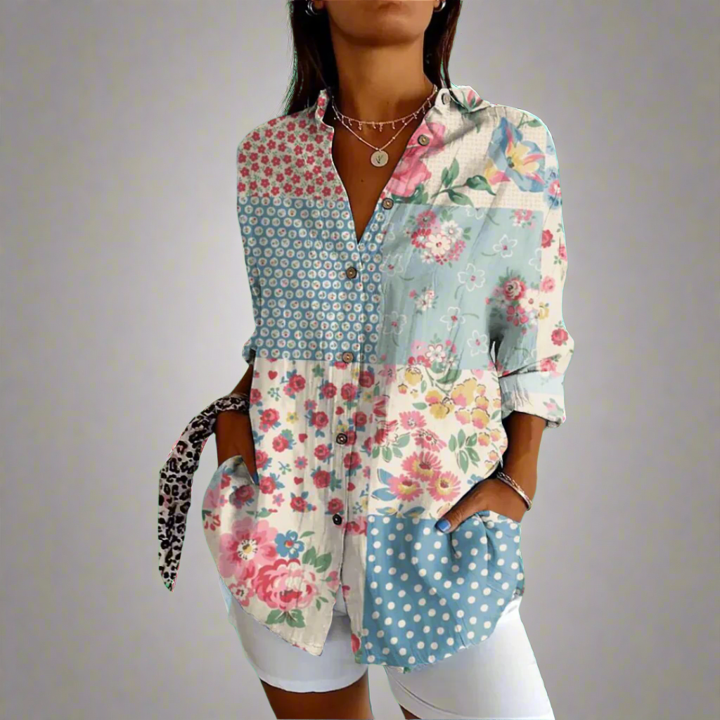 Chemise patchwork femme à motifs floraux et géométriques, manches longues, col boutonné, portée avec un short blanc. Mode tendance et décontractée.