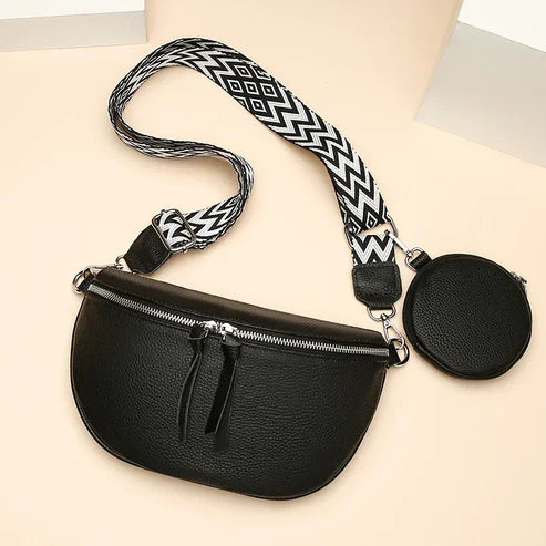 Sac banane noir en cuir avec sangle à motifs géométriques noir et blanc, pochette ronde attachée, mode tendance, accessoire pratique.