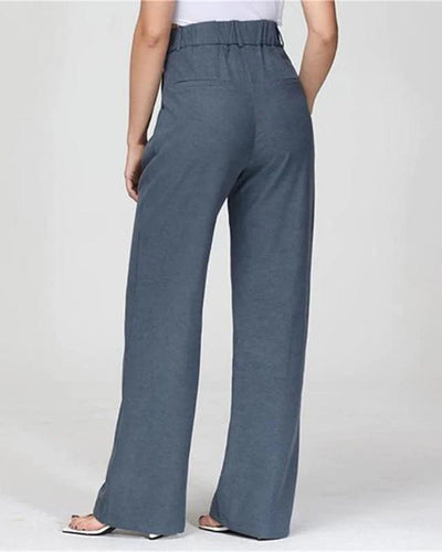 Pantalon large bleu pour femme, taille haute, style décontracté, tissu léger, mode tendance, vue arrière, idéal pour tenues estivales.