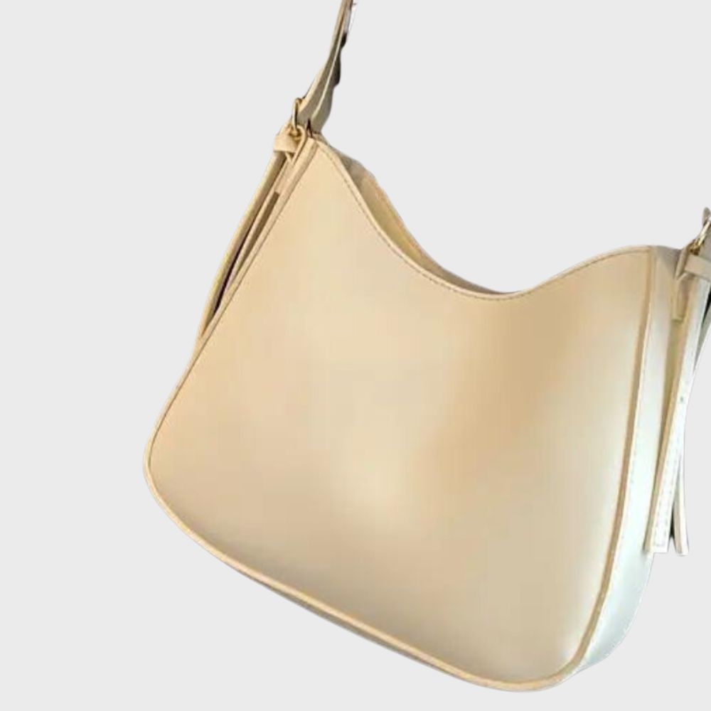 Sac à main en cuir beige élégant, design minimaliste, bandoulière ajustable, parfait pour un style chic et moderne. Accessoire mode tendance.