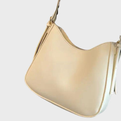 Sac à main en cuir beige élégant, design minimaliste, bandoulière ajustable, parfait pour un style chic et moderne. Accessoire mode tendance.