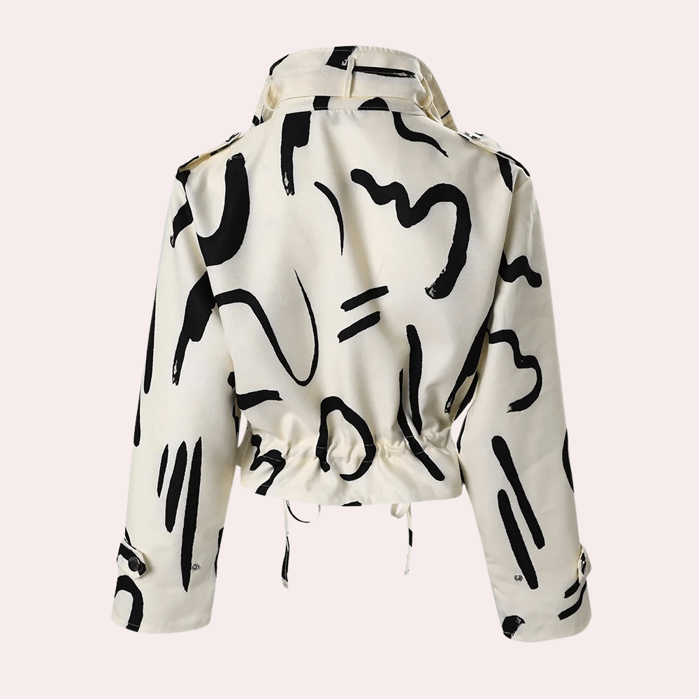 Veste blanche à motifs noirs abstraits, style moderne, manches longues, col rabattu, ajustable à la taille. Mode tendance, design artistique.