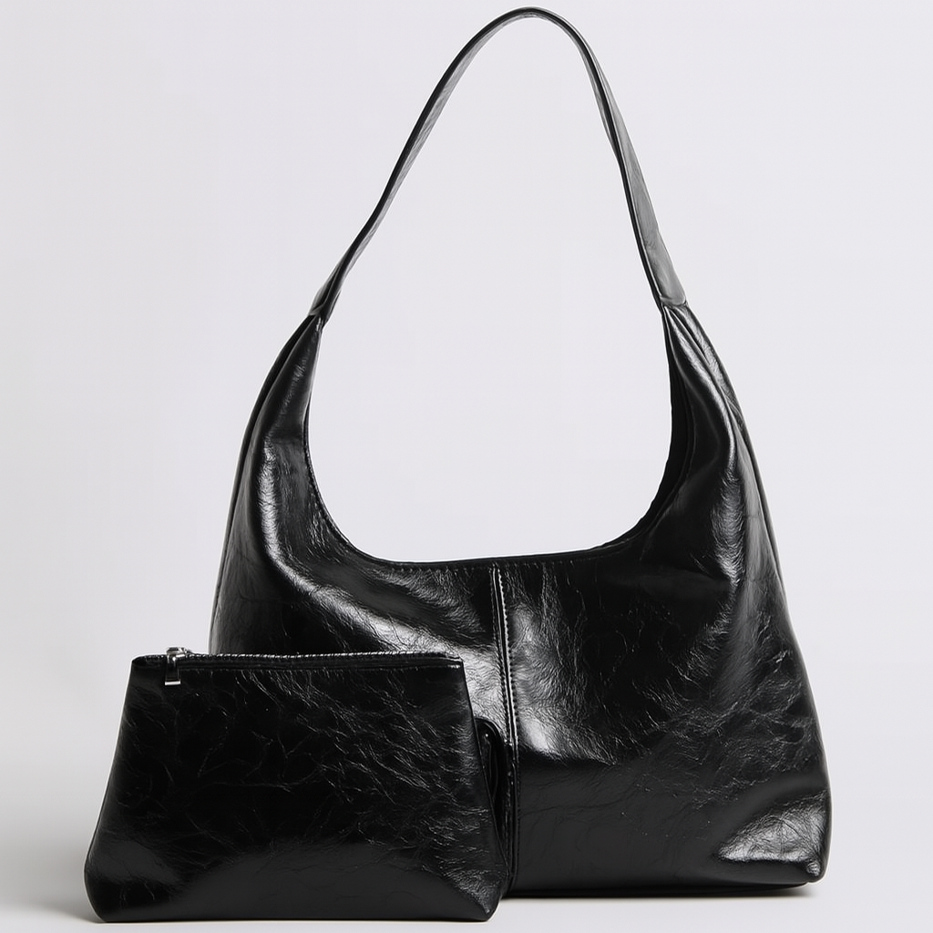 Sac à main noir en cuir avec pochette assortie, design moderne et élégant, idéal pour la mode féminine. Accessoire tendance et chic.