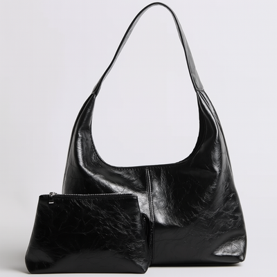 Sac à main noir en cuir avec pochette assortie, design moderne et élégant, idéal pour la mode féminine. Accessoire tendance et chic.