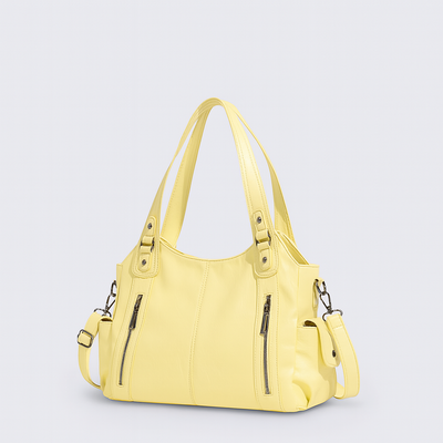 Sac à main en cuir jaune avec bandoulière amovible, deux poches zippées à l'avant, design moderne et élégant, accessoire mode femme tendance.