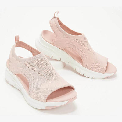 Sandales roses en maille respirante avec semelle blanche épaisse, design moderne et confortable, idéales pour l'été et la marche quotidienne.