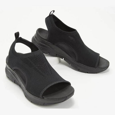 Sandales noires en maille respirante avec semelle épaisse, design moderne et confortable, idéales pour l'été. Chaussures légères et stylées.