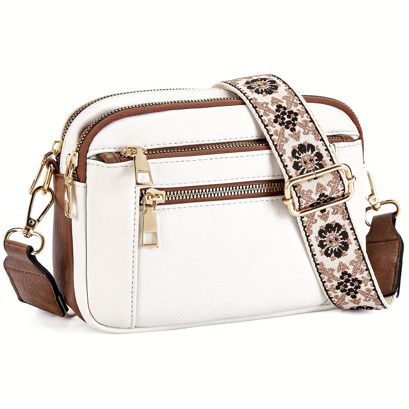 Sac à bandoulière blanc en cuir avec détails marron, fermeture éclair dorée et sangle florale ajustable. Accessoire mode élégant et tendance.