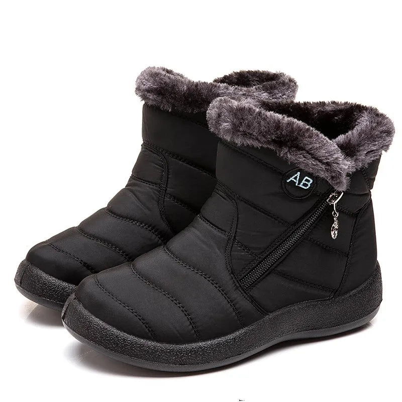 Botines negros de mujer forrados en polar, cómodos y casuales.
