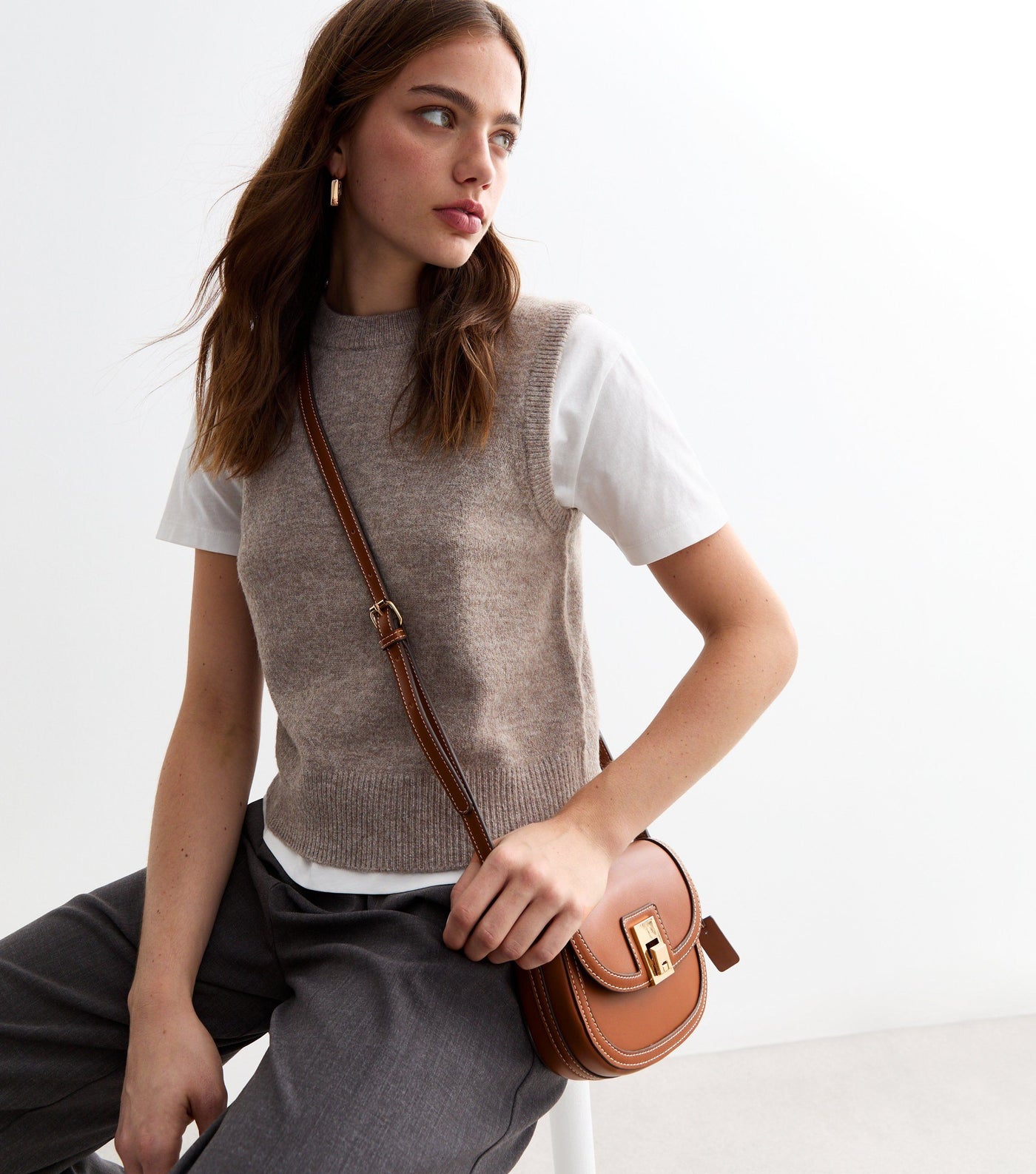 Brown women's crossbody bag with flap