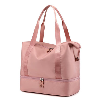 Sac de sport rose avec compartiment inférieur zippé, poignées longues, idéal pour fitness, voyage, rangement pratique et élégant.