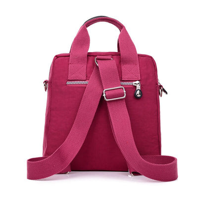 Sac à dos rose pour femme, design moderne, avec bretelles ajustables et fermeture éclair, idéal pour le quotidien et les voyages.