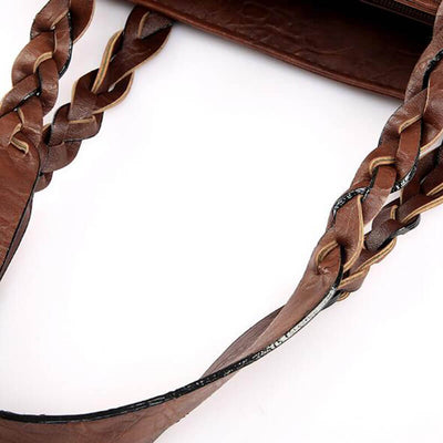 Sac à main en cuir marron avec anses tressées, élégant et tendance, idéal pour un look chic. Accessoire mode femme, style intemporel.