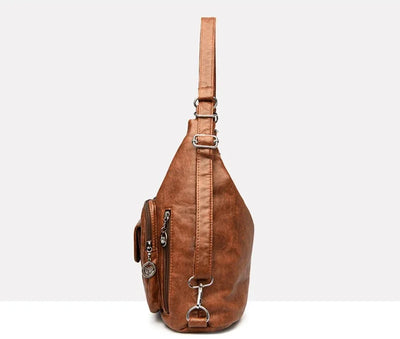 Sac à bandoulière en cuir marron, design moderne, avec poches zippées et bandoulière ajustable. Accessoire mode tendance pour femmes.