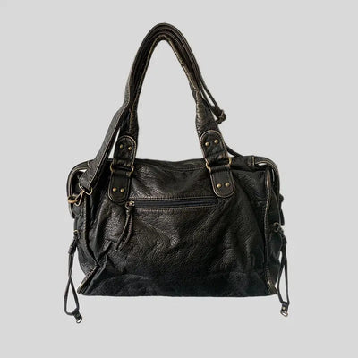 Sac à main en cuir noir élégant avec poignées doubles, poche zippée avant, détails métalliques, idéal pour mode femme et accessoires tendance.