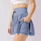 Mini falda de talle alto con short integrado, pliegues elegantes - Perfecta para el otoño