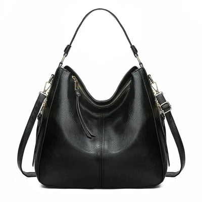 Sac à main noir en cuir élégant avec bandoulière réglable et fermeture éclair dorée, design moderne et spacieux, accessoire mode femme tendance.