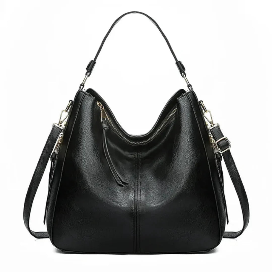 Sac à main noir en cuir élégant avec bandoulière réglable et fermeture éclair dorée, design moderne et spacieux, accessoire mode femme tendance.