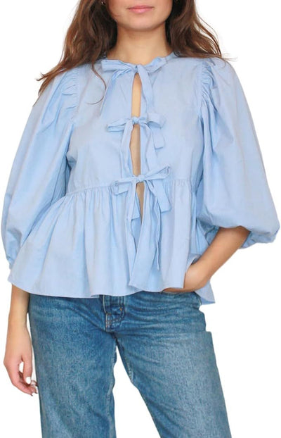 Blouse chic à manches bouffantes et devant cravate pour un style sans effort