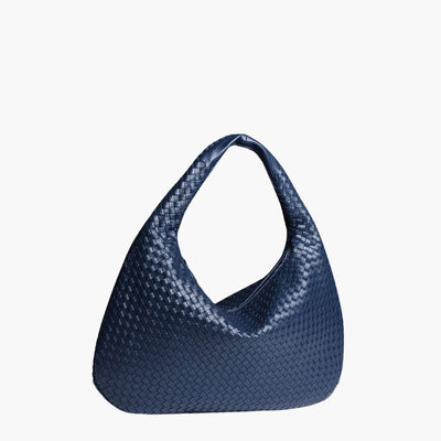 Sac à main bleu en cuir tressé, design moderne et élégant, parfait pour la mode féminine. Accessoire tendance et chic pour toutes occasions.