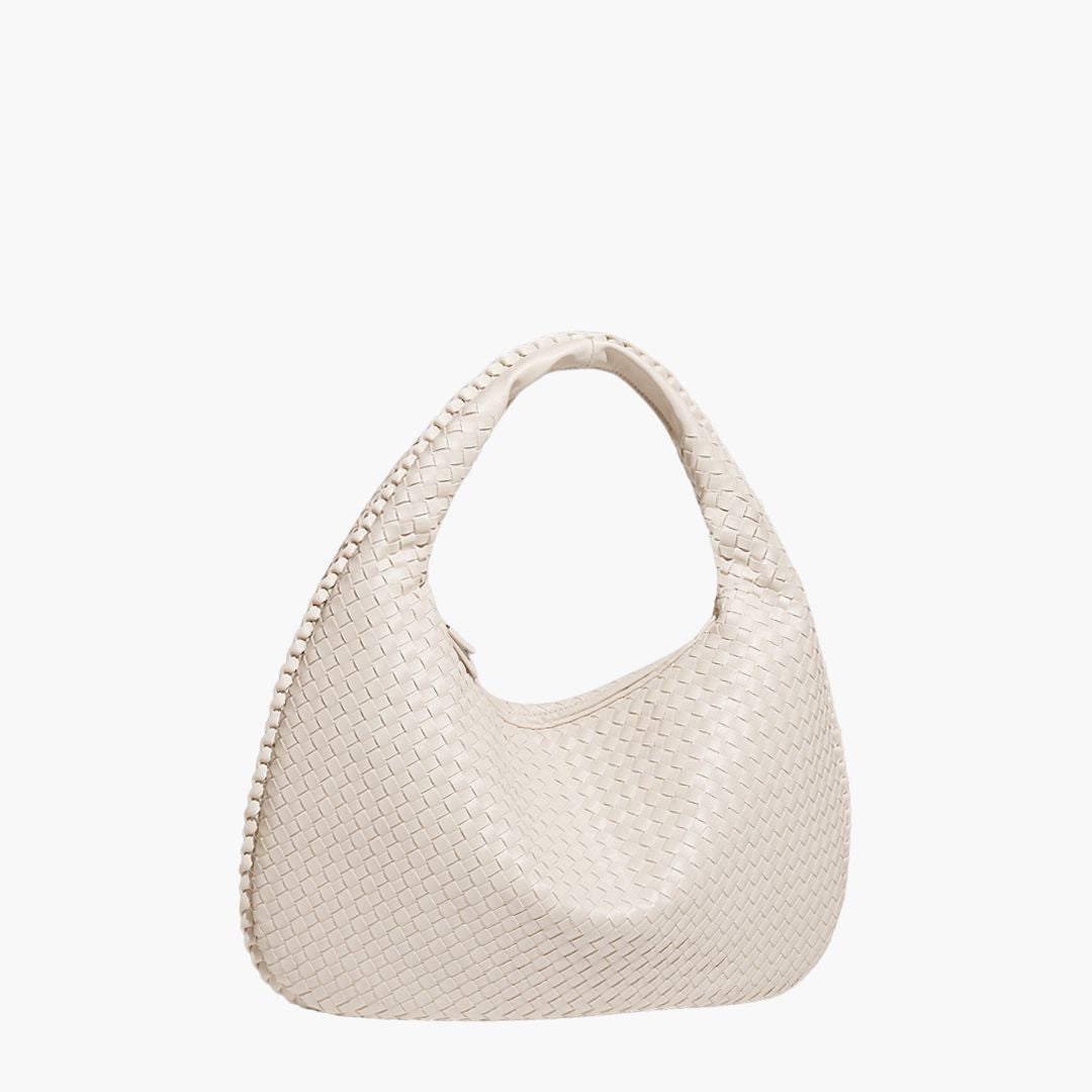 Sac à main en cuir tressé blanc cassé, design élégant et moderne, idéal pour la mode féminine. Accessoire tendance pour toutes occasions.