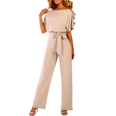 Combinaison élégante beige pour femme avec ceinture nouée, manches courtes et jambes larges, idéale pour un look chic et moderne.