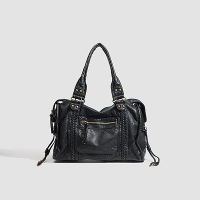 Sac à main en cuir noir élégant avec poches zippées et poignées robustes, idéal pour la mode féminine et le style urbain chic.