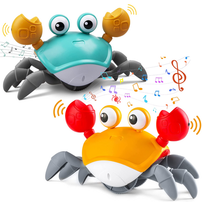 Deux jouets crabes colorés avec pinces mobiles, émettant des notes de musique et des symboles, sur fond blanc. Jouets interactifs pour enfants.