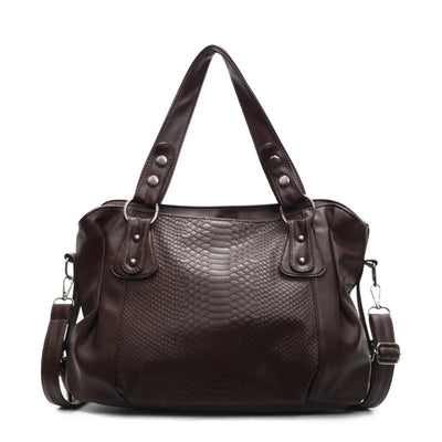 Sac à main en cuir marron foncé avec motif serpent, anses robustes et bandoulière amovible. Élégant et spacieux pour un usage quotidien.