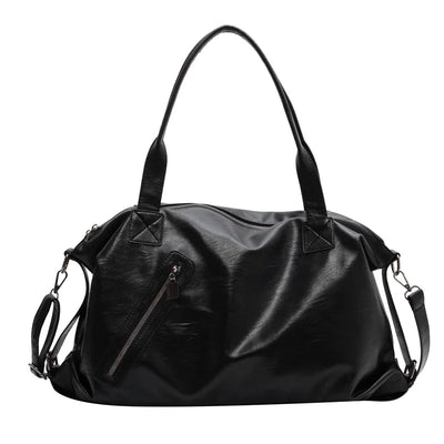 Sac à main en cuir noir élégant avec bandoulière amovible, poche zippée avant, idéal pour femme moderne. Accessoire mode tendance.